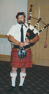 Tony Ferretti plays the bagpipes