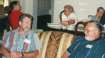 Two early birds chatting on a couch