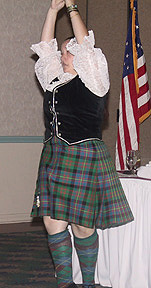 A girl in a kilt dances