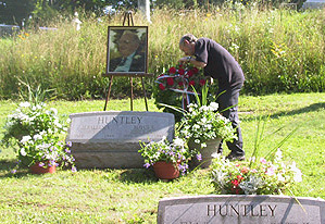 Richard lays a wreath at his Dad’s grave.
