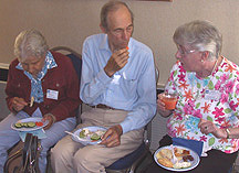 Several people eating snacks and chatting