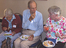 Several people eating snacks and chatting
