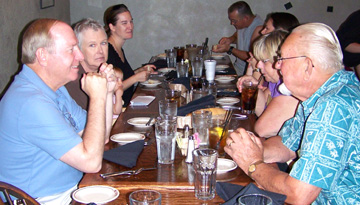 Several people eating around a table