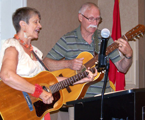 Stephany and Arnold playing guitars