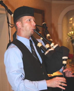 Tommy playing a bagpipe