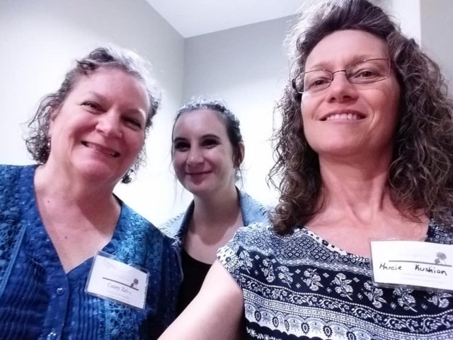 Three women smiling