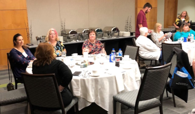 Several people sitting at a table