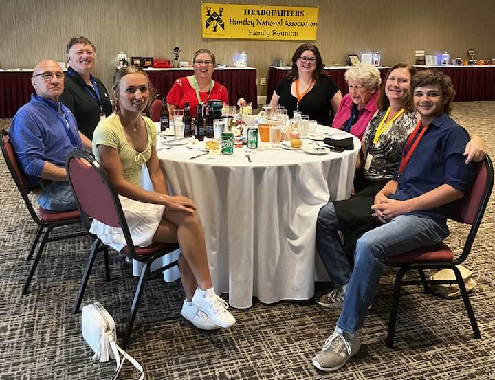 Another 8 attendees sitting at a table.